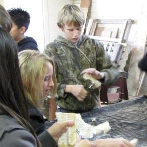students-skinning-codfish-in-preparation-for-cranfills-gap-lutefisk-supper